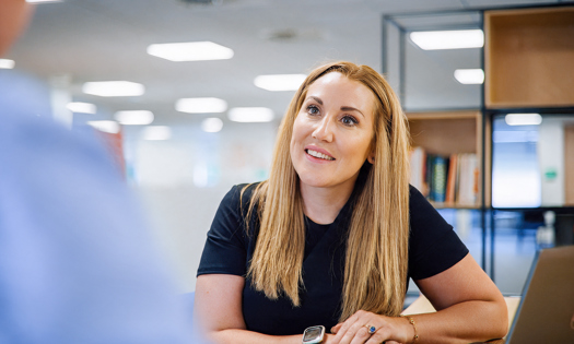 Victoria King Lowe smiling in an office
