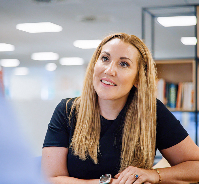 Victoria King Lowe smiling in an office