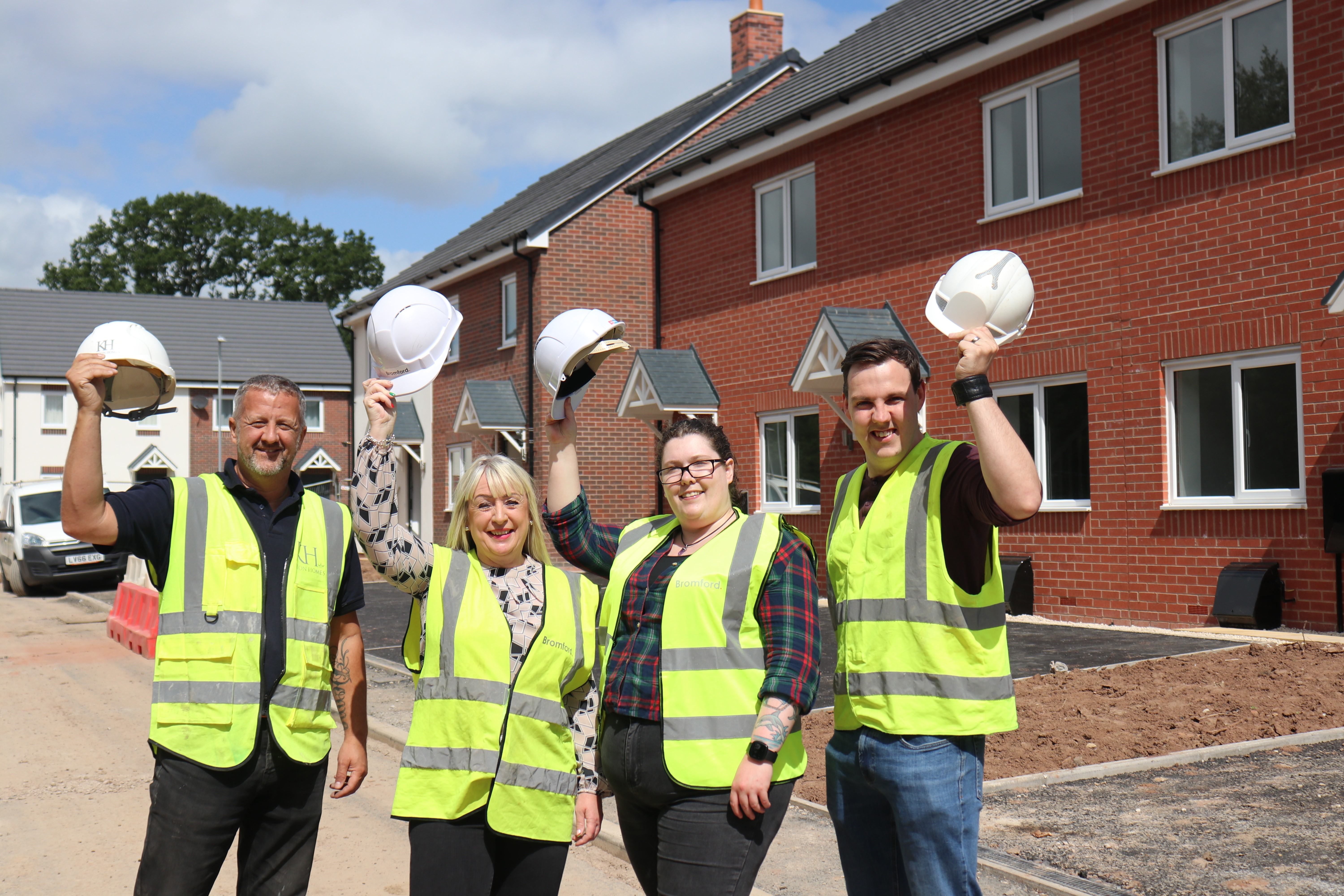 Steve Wood, Tracey Brewer, Rachel Phillips, and Connor Williams celebrate the new homes in Telford