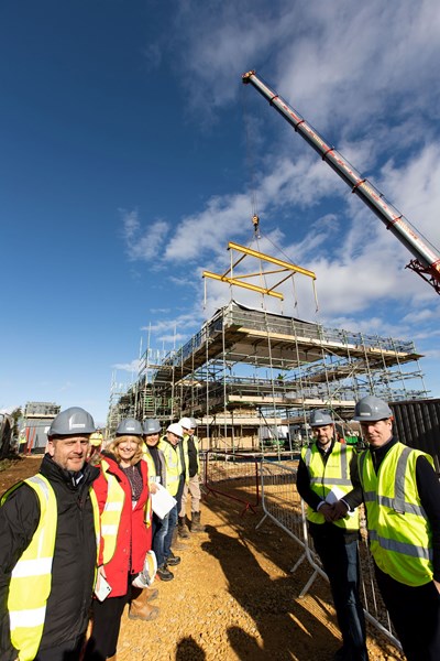 Bromford colleagues join Cllr Joe Harris in watching some of the first MMC homes arrive at Stockwells