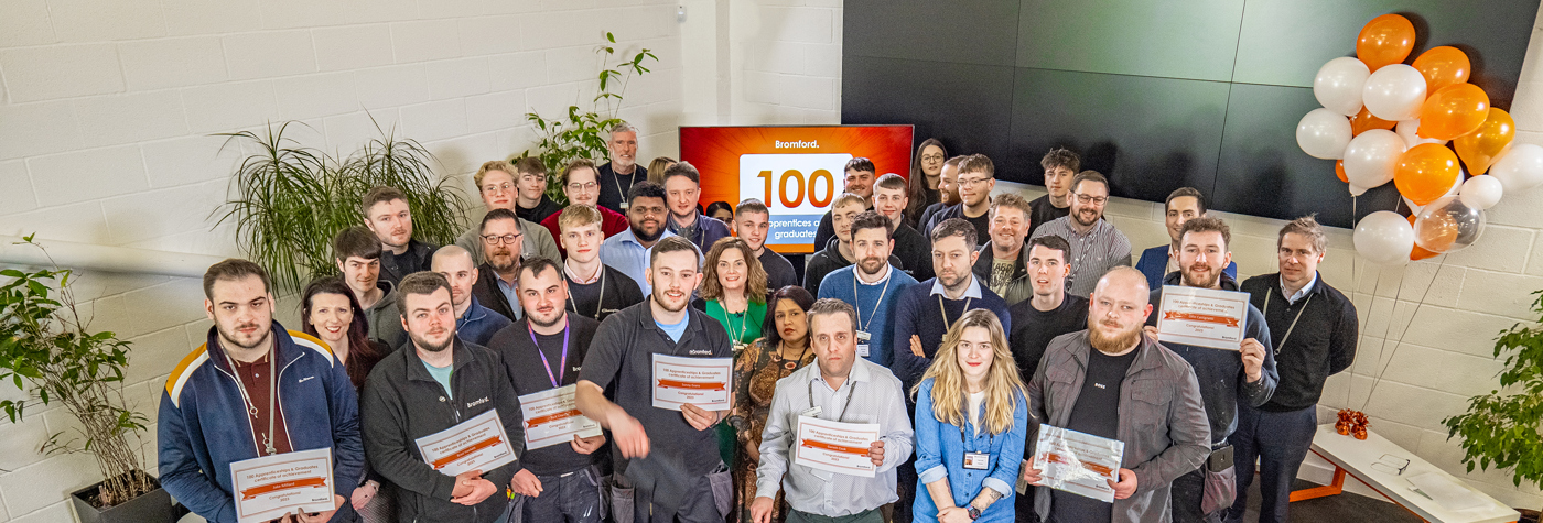 Bromford colleagues holding award certificates