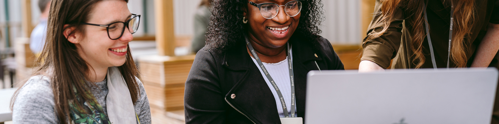 Image of Bromford colleagues using a laptop outside