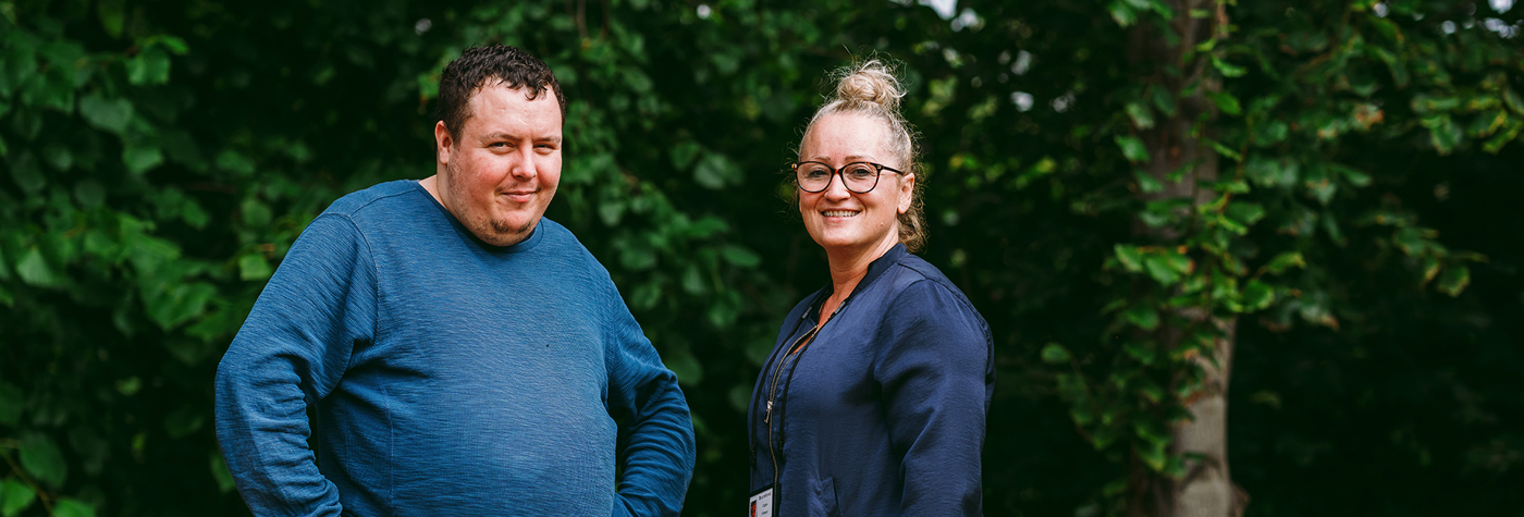 a bromford customer talking to their neighbourhood coach in their garden
