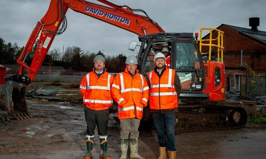 From left, Bromford senior quantity surveyor Karl Ogden, construction manager James Atkinson, and senior pre-contract manager Adam Crompton, at Great Western Yard, where former railway buildings are making way for 113 new Bromford homes, part of 315 total on the site (Credit: Becky Randall, Pixel PR Photo)