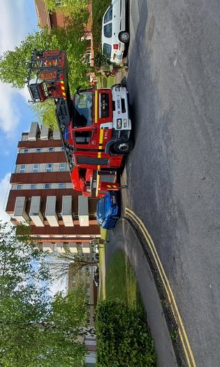 fire engine in front of flats