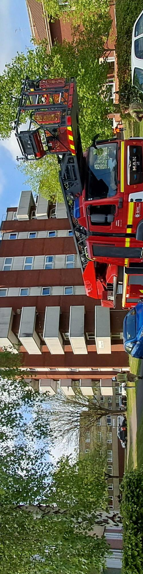 fire engine in front of flats