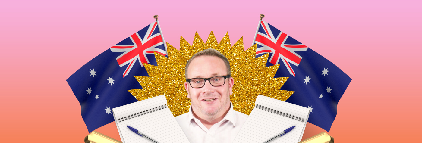 Allan Maund in front of Australian flags 