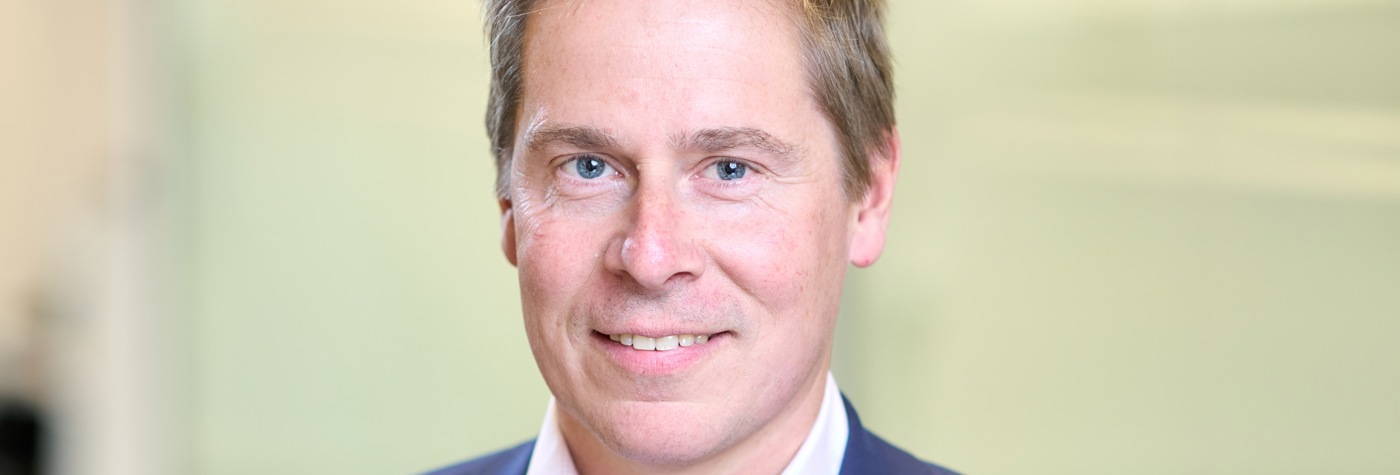 Head and shoulders photograph of a Bromford's chief executive Robert Nettleton in an office