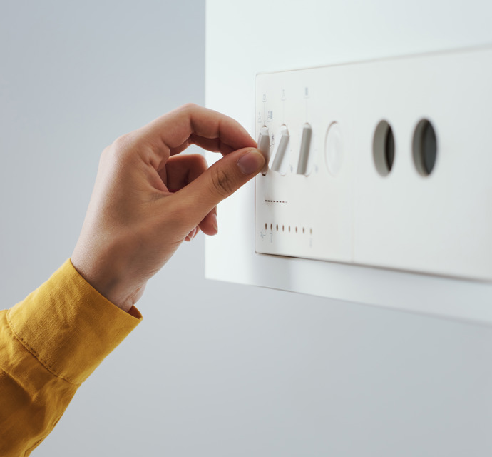 Woman Checking Settings On The Boiler 2025 01 09 00 27 59 Utc